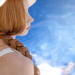 close-up-woman-sitting-by-pool
