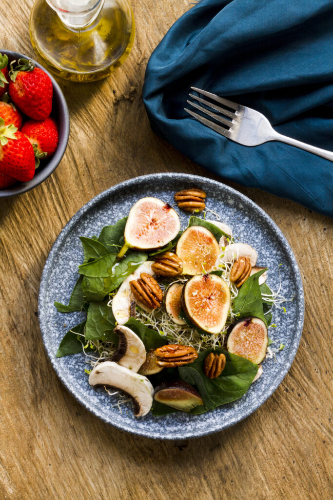 flat-lay-mix-nuts-figs-plate-with-strawberries