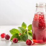 refreshing-raspberry-beverage-glass-bottle-with-fresh-raspberries-mint-leaves-white-background_9975-124692