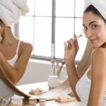 woman-sitting-with-towel-mirror