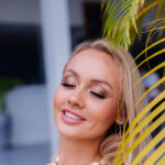 young-caucasian-calm-happy-pretty-woman-with-bright-evening-makeup-wearing-summer-yellow-dress-sea-shell-necklace