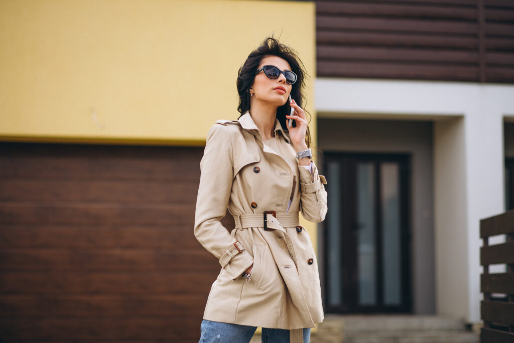 Young business woman oitside by the house