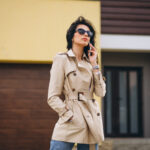 Young business woman oitside by the house